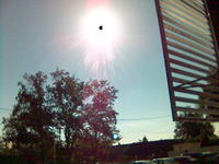 Annular eclipse of 3 October 2005, from Bordeaux, France. I didn't have the required protection glasses, so delegated to my cell phone. Picture shows a big optical distortion though.